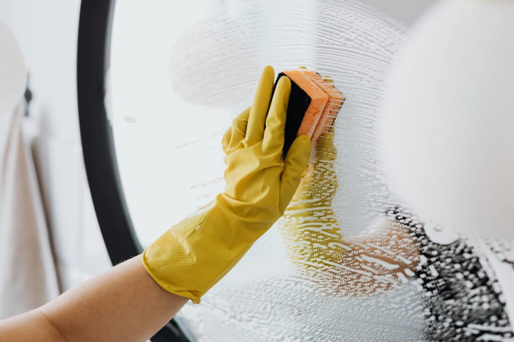 Expert cleaner wiping down a kitchen in an Austin apartment
