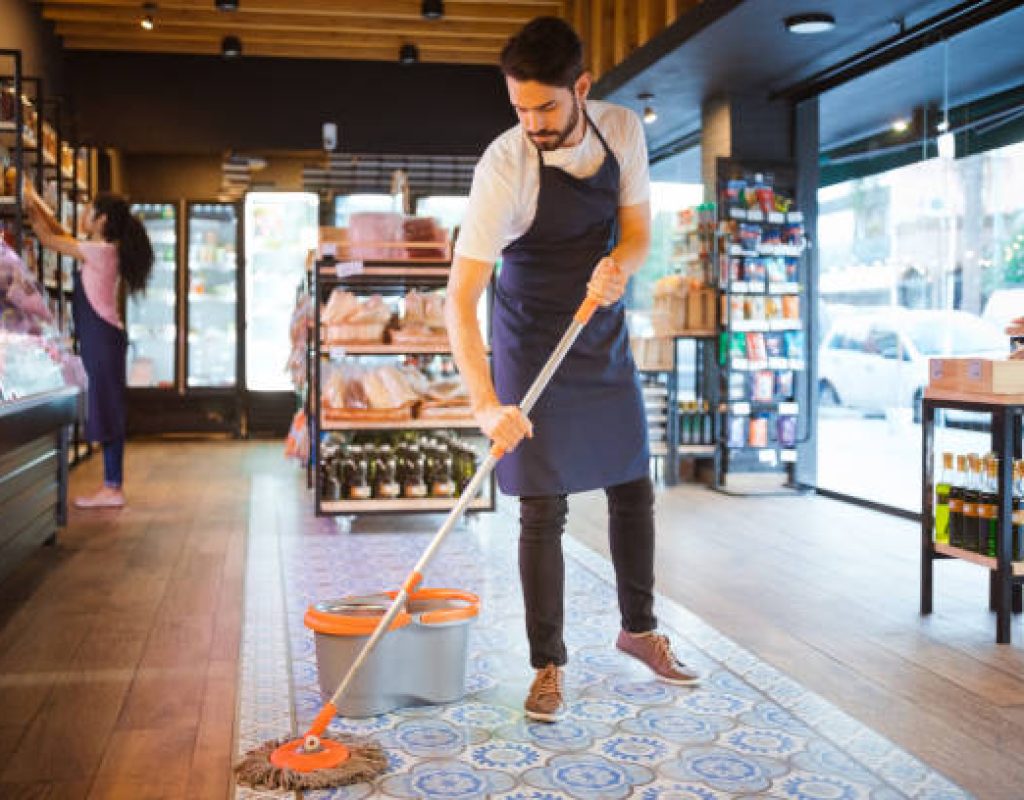 Retail cleaning team disinfecting store surfaces thoroughly in Georgetown TX
