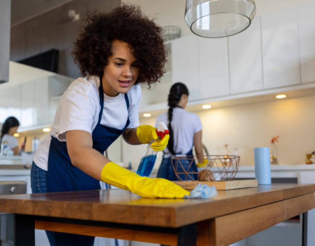 Reliable cleaning specialist dusting and organizing rooms during routine service visits.